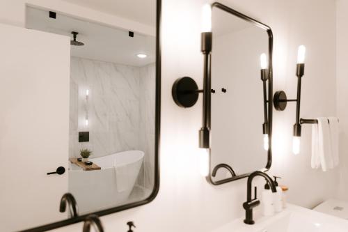 a bathroom with a sink and a mirror at Nature Link Resorts in Nisswa