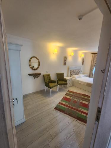 Postel nebo postele na pokoji v ubytování Tarçın Alaçatı Otel