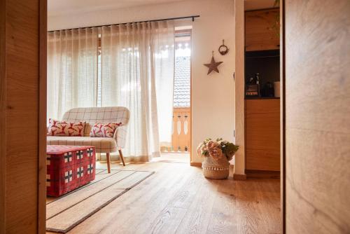 a living room with a couch and a chair at Vila Pavlina in Kranjska Gora