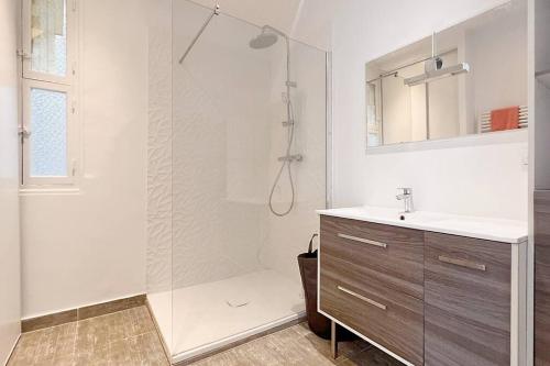 a bathroom with a shower and a sink at Le Palais Riviera in Nice