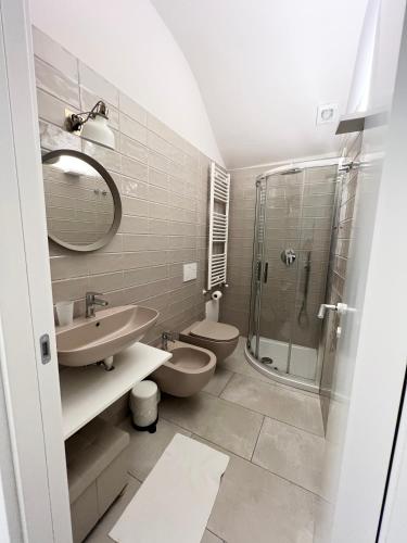 a bathroom with a toilet and a sink and a shower at L Antico Forno Bari Centro Storico in Bari