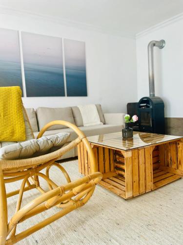 a living room with a coffee table and a couch at Landhaus mit Garten in Neutal