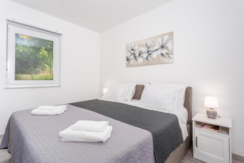 מיטה או מיטות בחדר ב-Kvarner bay 4* - Apartments 1 & 3