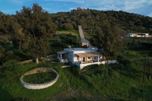 an aerial view of a house on a hill at Annas Katikia in Drymonas