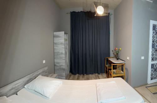 Postel nebo postele na pokoji v ubytování Nid Hotel