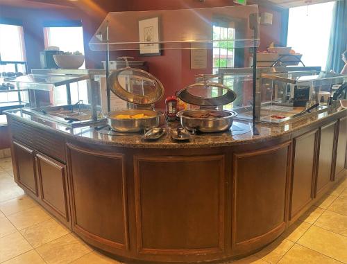 a counter with pots and pans on top of it at Staybridge Suites Great Falls by IHG in Great Falls