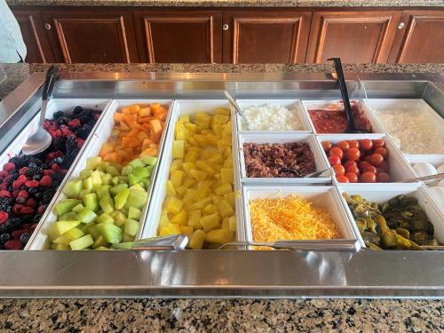 a bunch of different fruits and vegetables in trays at Staybridge Suites Great Falls by IHG in Great Falls