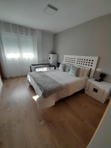 Ένα ή περισσότερα κρεβάτια σε δωμάτιο στο Apartamento Calvarios