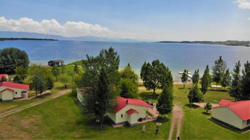 an aerial view of a lake with houses and trees at Geghama Garden House - Resort Sevan in Sevan