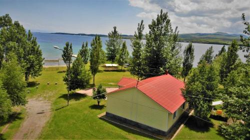an aerial view of a smallshed with an orange roof at Geghama Garden House - Resort Sevan in Sevan