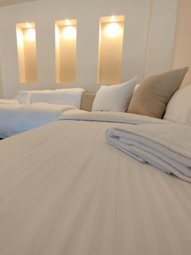Una cama o camas en una habitación de Primula