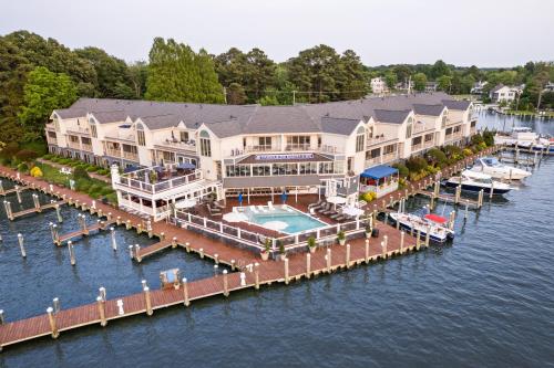 an aerial view of a large house on the water at St Michaels Harbour Inn, Marina and Spa in Saint Michaels