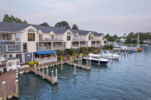 a marina with several houses and boats on the water at St Michaels Harbour Inn, Marina and Spa in Saint Michaels