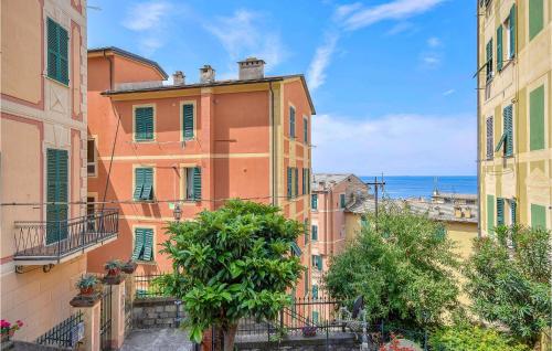 a view of buildings in a city with the ocean at Stunning Home In Camogli With Kitchen in Camogli