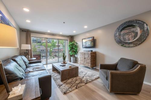 a living room with a couch and a table at Treasure Mountain Inn in Park City