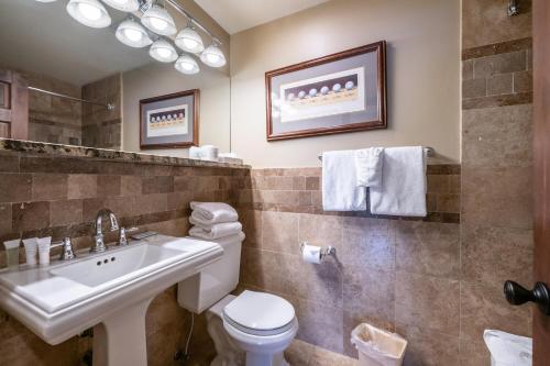 a bathroom with a toilet and a sink at Treasure Mountain Inn in Park City