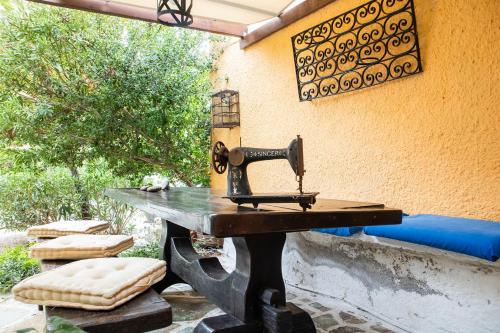 a sewing machine sitting on top of a table at Vagia Traditional, Aegina Island in Vaia