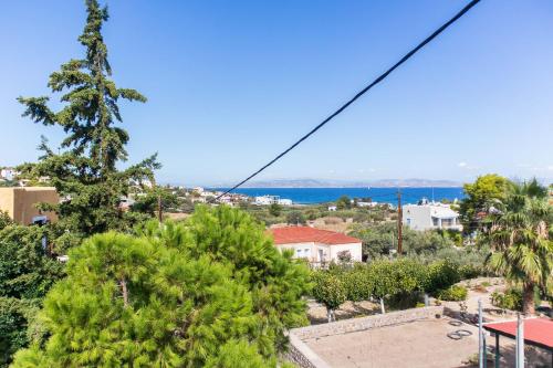 a view of the ocean from the balcony of a house at Vagia Traditional, Aegina Island in Vaia