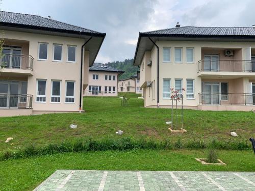 a yard in front of a house with a yard sidx sidx sidx at Countryside Resort Sarajevo in Hadžići