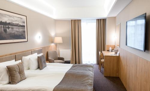 Nota Bene Hotel & Restaurantにあるベッド