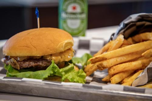 a hamburger and french fries on a tray at Holiday Inn Toledo - Maumee I-80/90 by IHG in Maumee