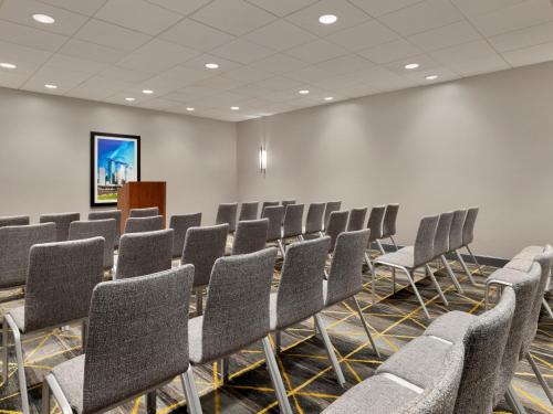 a conference room with chairs and a podium at Holiday Inn Toledo - Maumee I-80/90 by IHG in Maumee