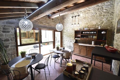 a restaurant with tables and chairs in a room at B&B A…Monte in Santa Maria