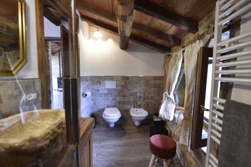 a bathroom with a toilet and a sink at B&B A…Monte in Santa Maria