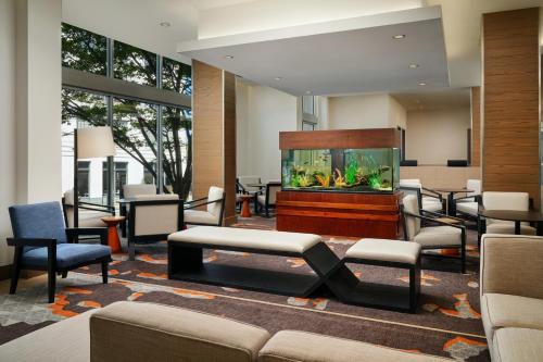 a lobby with a fish tank in a room at Hyatt House Atlanta Downtown in Atlanta