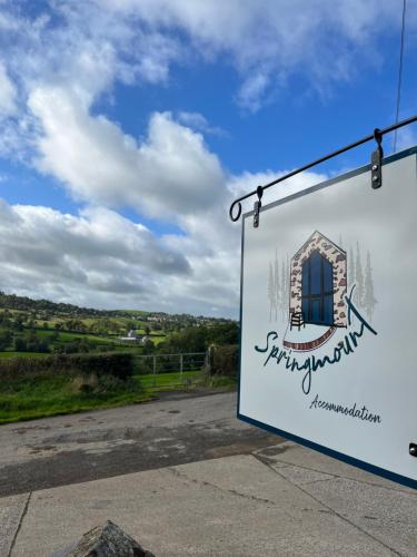 a sign for the entrance to a wine estate at The Stable Springmount Accommodation in Dromara