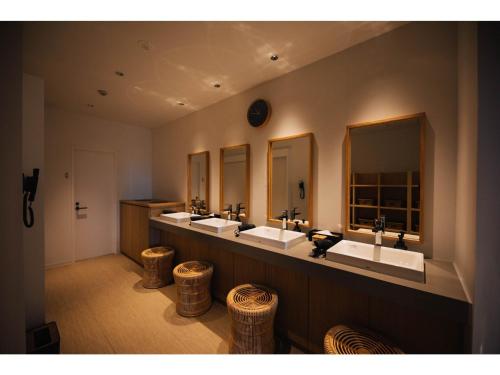 a bathroom with three sinks and four mirrors at Colorit Goto Islands - Vacation STAY 61533v in Goto