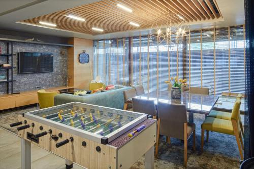 a room with a table with a foosball at Holiday Inn Istanbul - Kadikoy by IHG in Istanbul