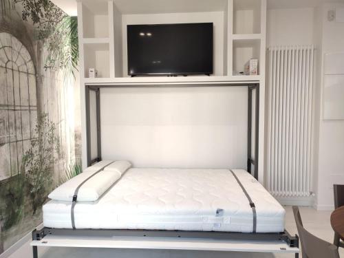 Ένα ή περισσότερα κρεβάτια σε δωμάτιο στο AL PONTE design apartment