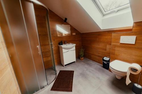 a bathroom with a toilet and a shower and a sink at BIRD HOUSE in Prešov