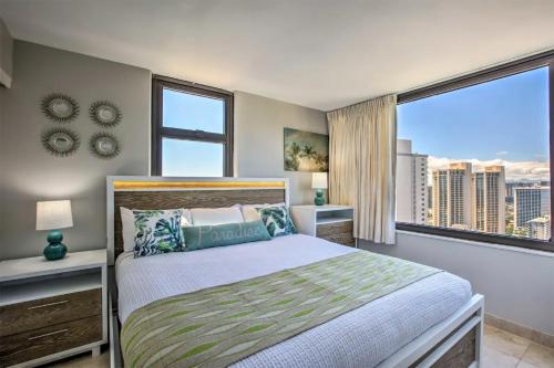a bedroom with a bed and a large window at Beach Oasis with Ocean & City Views with FREE Parking! in Honolulu
