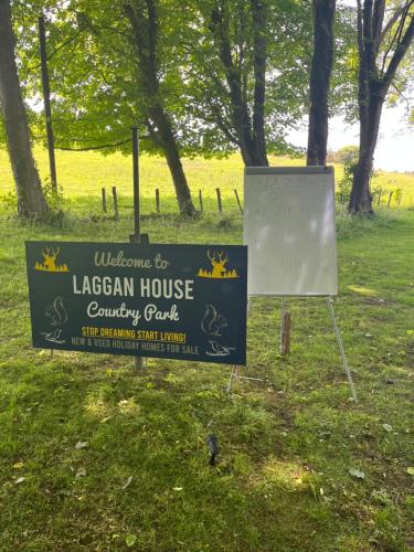 a sign for a lacey house country park at Unique Caravan with Outdoor Space in Ballantrae