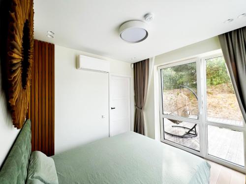 Lova arba lovos apgyvendinimo įstaigoje Pinecone terrace - 2 bedrooms apartment with terrace Nida