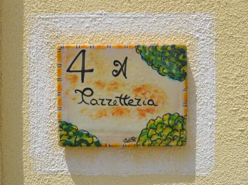 a birthday cake for a rattoria on a wall at HOTEL Cala Buguto in Custonaci