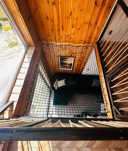 an inside view of a cage in a building at Bliżej Lasu in Śliwice