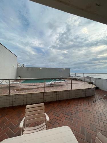 a pair of chairs sitting on the roof of a building at American Flat in São Luís