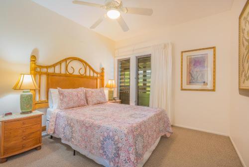 a bedroom with a bed and a ceiling fan at Oceanfront 1 BR Condo at Kaha Lani KL309 in Kapaa