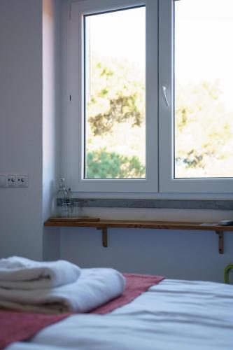 Ένα ή περισσότερα κρεβάτια σε δωμάτιο στο Azen Cool House