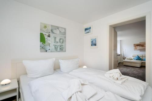 Ένα ή περισσότερα κρεβάτια σε δωμάτιο στο Sylter Residenz