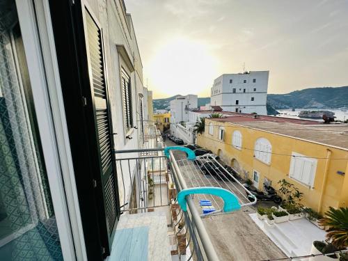 a balcony with a view of a city at Sky Ponza - Immobilevante in Ponza