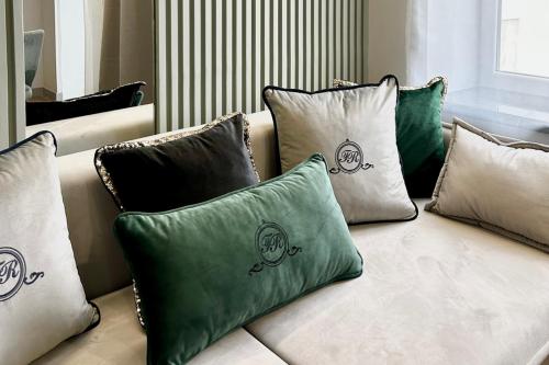 a group of pillows sitting on a couch at Central Family Boutique Apartments 3 in Lviv