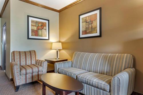 a living room with a couch and a chair at Best Western Plus Texoma Hotel & Suites in Denison