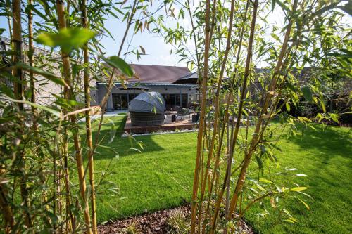 a yard with a house with a dome tent at Best Western Premier Le Chapitre Hotel and Spa in Remiremont