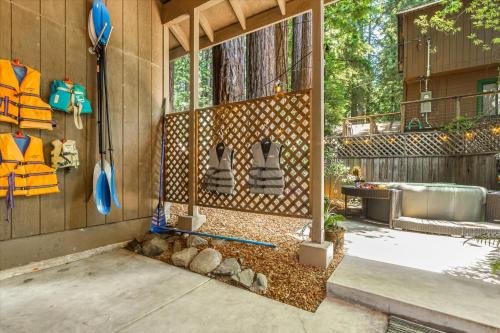 a backyard with a shower in a house at Lazy River Lodge - Hot Tub On the River Kayaks in Guerneville