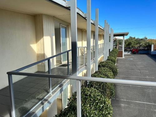 a balcony of a building with a parking lot at Brooklands Of Mornington in Mornington