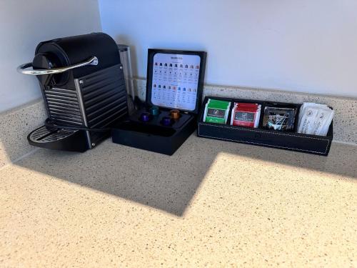 a room with a counter top with a box with a phone at Brooklands Of Mornington in Mornington